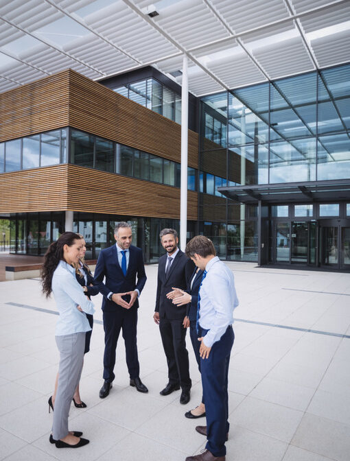 group-businesspeople-interacting-outside-office-building (2)